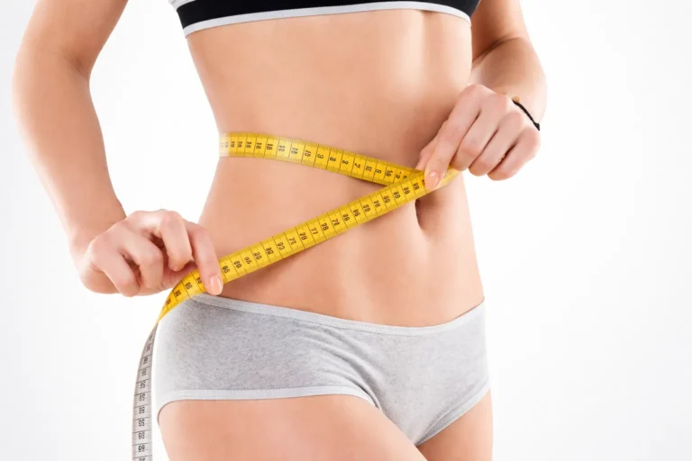 Woman measuring her body with a tape measure to achieve accurate clothing fit